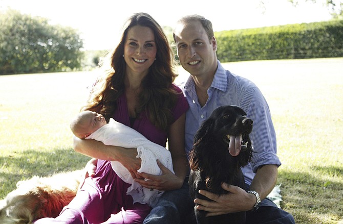 Taken by Michael Middleton, the Duke and Duchess of Cambridge are shown with their son, Prince George, in the garden of the Middleton family home.