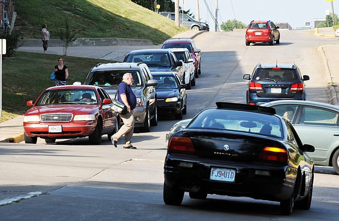 Employees leaving the Employment Security building on E. Dunklin Street have to cross Jackson Street to the building's parking lot. A lawsuit has been filed against Jefferson City after a woman was injured while crossing the street on the way to work.