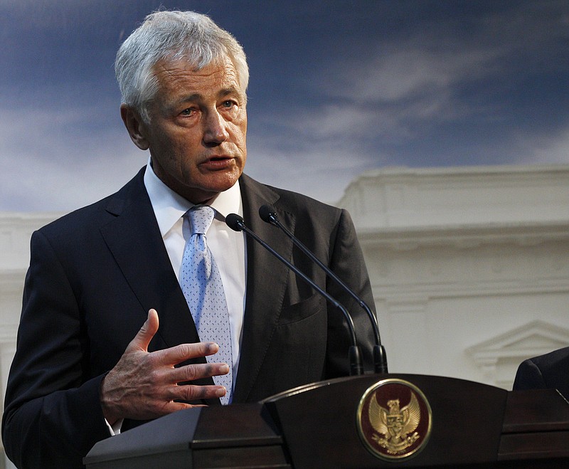 Defense Secretary Chuck Hagel speaks Monday in Jakarta, Indonesia. U.S. forces are now ready to act on any order by President Barack Obama to strike Syria, Hagel said Tuesday. The U.S. Navy has four destroyers in the eastern Mediterranean Sea positioned within range of targets inside Syria, as well as U.S. warplanes in the region, Hagel said in an interview with BBC television during his visit to the southeast Asian nation of Brunei.