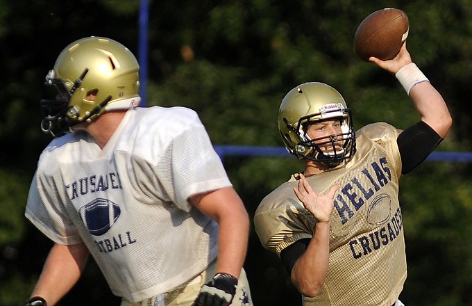 Helias quarterback Wyatt Porter throws a pass during a preseason scrimmage at Helias Field. Porter, a senior, is returning for his second season as the Crusaders' starting quarterback.