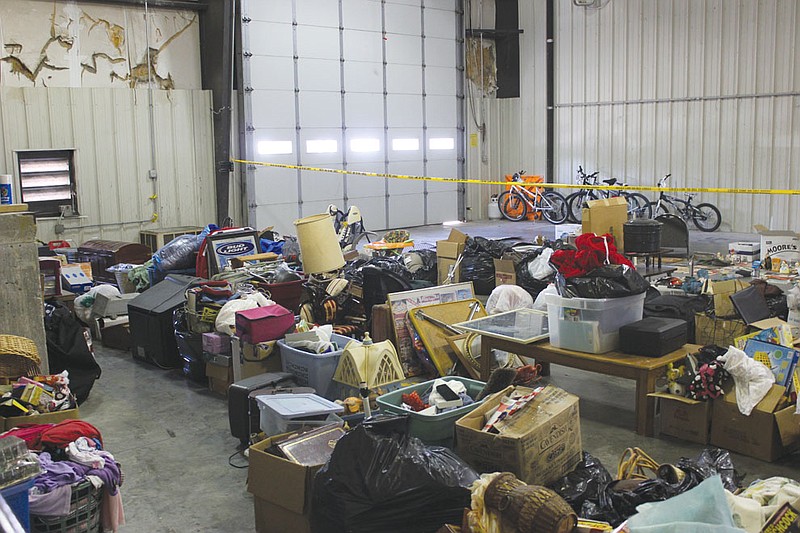 Just a portion of the unclaimed stolen property recovered by the Fulton Police Department fills the station's sally port Wednesday. FPD is urging central Missouri residents to file reports with their local law enforcement agencies before bringing the report to Fulton if they suspect property has been stolen from their home or storage unit.