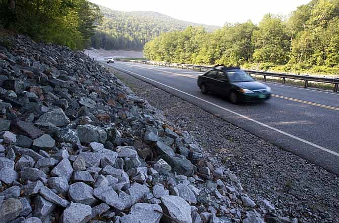In this Aug. 22, 2013 photo, cars travel on the rebuilt Vermont Route 107 in Bethel, Vt.