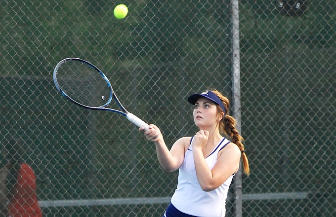 Helias senior Casey Clogston returns the ball during her match against Mexico on Thursday at Washington Park.