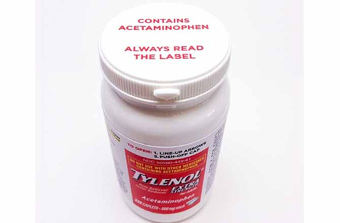 This undated product image provided by Johnson & Johnson shows a bottle of Extra Strength Tylenol bearing a new warning label on the cap alerting users to potentially fatal risks of taking too much of the pain reliever. Johnson & Johnson, the company that makes Tylenol, says the warning will appear on the cap of new bottles of Extra Strength Tylenol sold in the U.S. starting in October 2013 and on most other Tylenol bottles in coming months. 