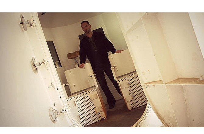 In this publicity photo from TravelChannel.com, Nick Groff of "Ghost Adventures" retraces the last steps of death row prisoners in the gas chamber at the Missouri State Penitentiary.