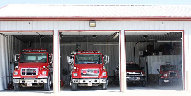 Four fire trucks are stored in the three-bay Fire Station No. 5 at Reform in the South Callaway Fire Protection District. A new three-bay building addition is planned to the right of the current structure.