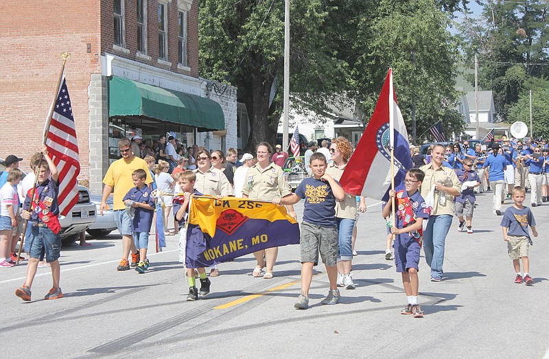 The local Boy Scouts lead the Mokane Fair parade Saturday morning.