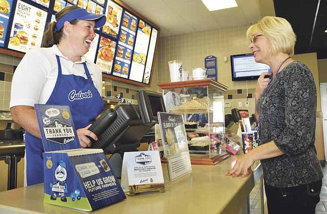 
Kendall Walz, general manager of the Jefferson City Culver's, waits on customer Karen Clayton of Hannibal as she stopped at the local restaurant. Culver's helps out local clubs and groups with fundraisers and have several scheduled in the near future.