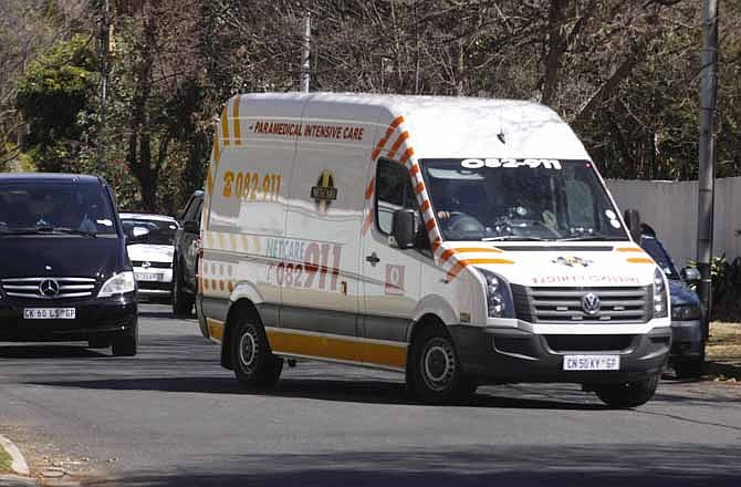 An ambulance transporting former South African president Nelson Mandela arrives at the home of the former statesman in Johannesburg, South Africa, Sunday, Sept. 1, 2013. Mandela had been in hospital for more than two months fighting a recurring lung infection.