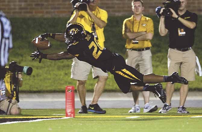 Missouri's Henry Josey leaps into the end zone as he scores on a 68-yard run during the third quarter of an NCAA college football game against Murray State, Saturday, Aug. 31, 2013, in Columbia, Mo. Missouri won the game 58-14. (AP Photo/L.G. Patterson)