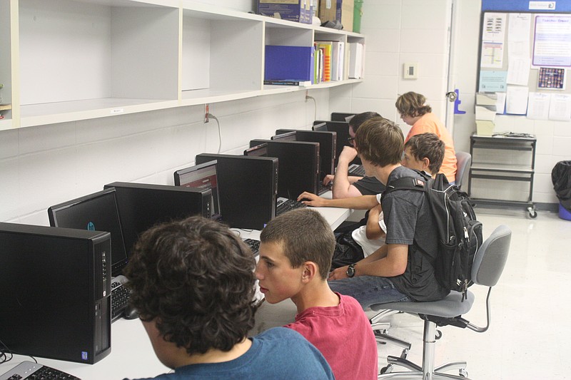 Russellville students are shown working with new video game programming software in a new business class called computer programming, which was a result of a recent federal grant to upgrade technology.
