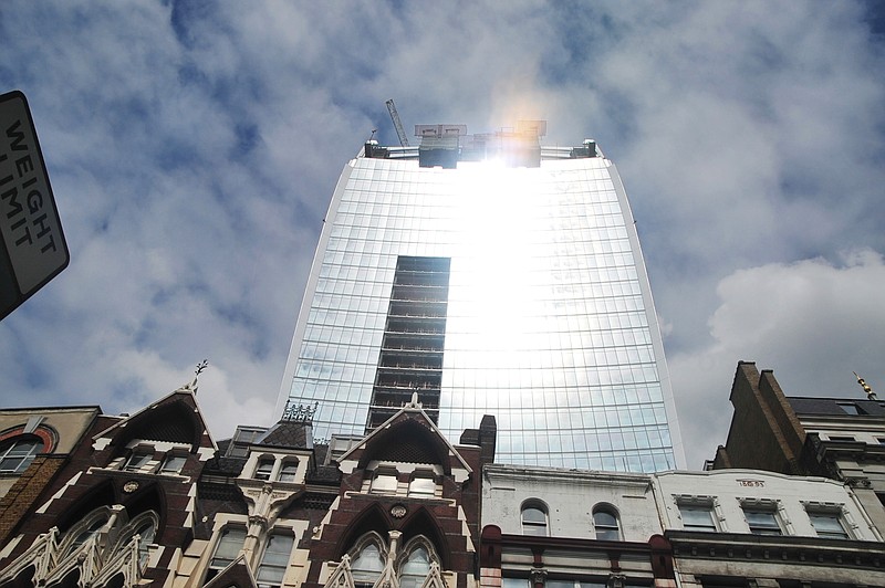 The 37-story skyscraper is shown Tuesday at 20 Fenchurch Street, is still under construction in the City of London. Developers for an unfinished skyscraper in central London say they are investigating the way the building reflects bright sunlight after claims that the intense glare melted parts of a car parked nearby.