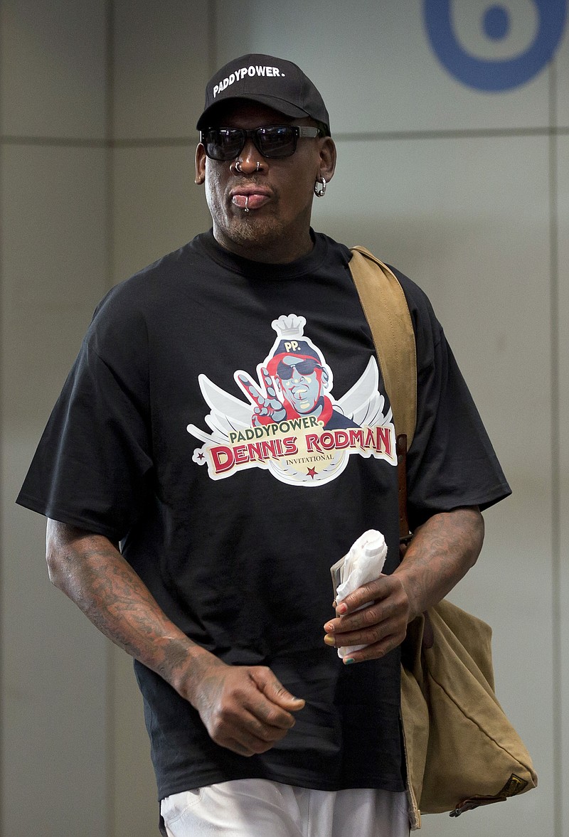 Former NBA star Dennis Rodman arrives Tuesday at the departure hall of Beijing International Capital Airport in Beijing. Rodman is heading to North Korea for the second time this year for what he says is a visit to his friend, the communist nation's leader, Kim Jong Un.