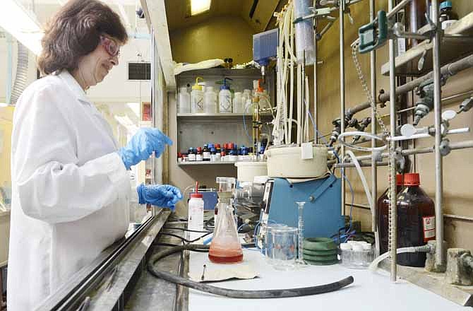 In this Aug. 28, 2013 photo, Kodak Research Technician, Grace Bennett, synthesizes proprietary Kodak ink for Kodak print applications in the synthetic chemistry lab at the Kodak research lab in Rochester, N.Y. 