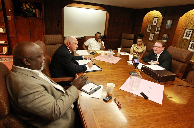 The leadership of the NAACP Casper branch speak Saturday with John Abarr, far right, a kleagle of the United Klans of America of Great Falls, Mont., at the Parkway Plaza hotel in Casper, Wyo. Jimmy Simmons, president of the NAACP Casper branch, spent several months attempting to organize the meeting due to concerns about reports of violence against black men and Ku Klux Klan pamphleting in Gillette, Wyo.