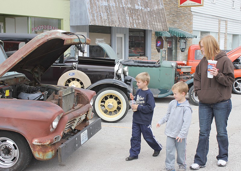 Visitors stroll through the 2012 Auxvasse Car Show. This year's show is scheduled for Sept. 21 and will feature the addition of two motorcycle classes and a rat class. Trophies will be awarded to the top three in each class.