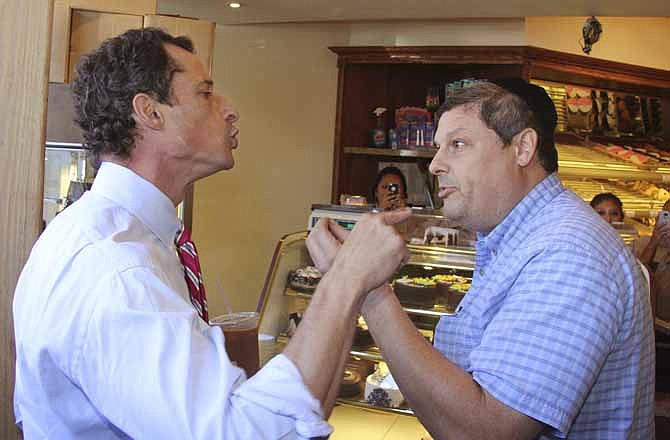 Anthony Weiner, left, who is seeking the Democratic nomination to run for the New York City Mayor's Office, has a heated argument with Shaul Kessler at Weiss Bakery in the Boro Park neighborhood in the Brooklyn borough of New York, Wednesday, Sept. 4, 2013.