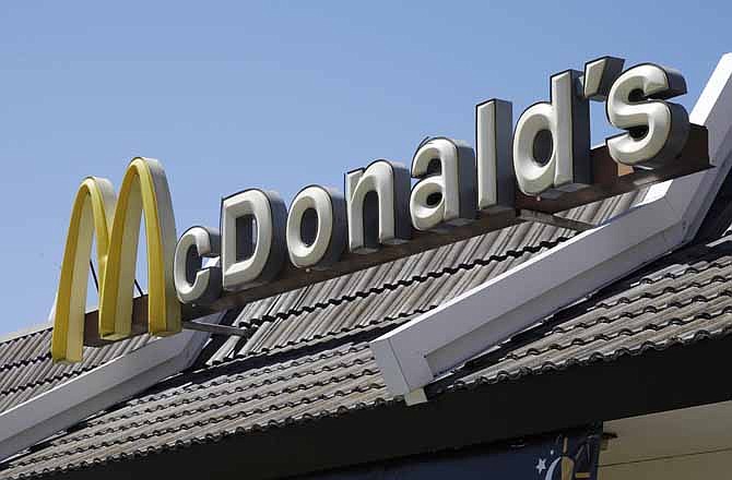  In this Friday, April 20, 2012, file photo, a McDonald's sign is shown at a McDonald's restaurant in East Palo Alto, Calif. 