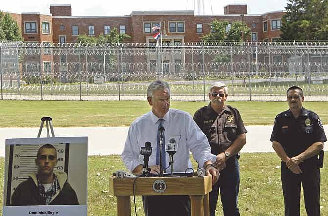 In this Aug. 30, 2013, photo Missouri Gov. Jay Nixon, center, outside the Sex Offender Rehabilitation and Treatment Services center in Farmington, Mo., discusses his veto of a bill overwhelmingly passed by the Legislature that would strike juvenile offenders from public-notification websites and eventually allow their removal from the sex-offender lists compiled by police. Lawmakers areÂ  to convene Wednesday, Sept. 11, 2013, to consider overriding Nixon's veto. (AP Photo/St. Louis Post-Dispatch, Christian Gooden) 