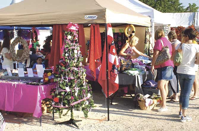 Local area residents flock to the Jaycees Fairgrounds in Jefferson City for the annual Cole County Extension Fall Festival. More than 160 vendors sold a wide variety of crafts and goods.