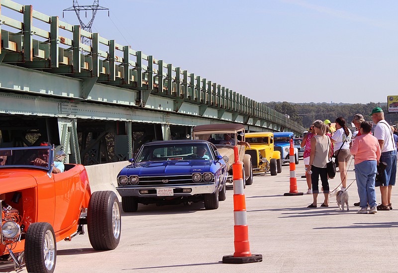 A parade of antique cars is one of the first sets of vehicles to travel across the new Hurricane Deck Bridge across the main channel of the Lake of the Ozarks. The bridge will open for public use on Tuesday, Sept. 10.-