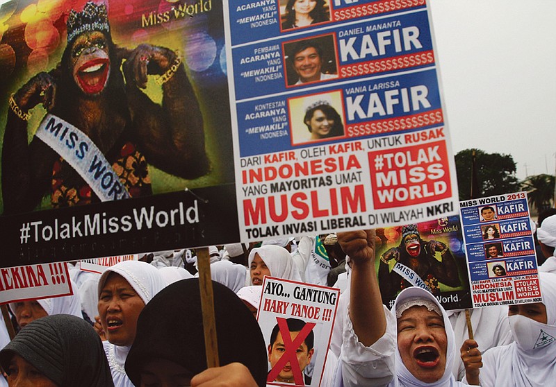 Muslim Women, above, protest in advance of the Miss World contest in Jakarta, Indonesia.