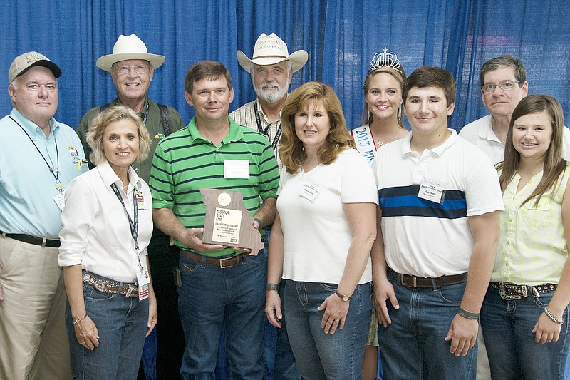 Photo submitted
With the Orely family are, from left to right, Ted Sheppard, Missouri State Fair Commission, Sherry Jones, Missouri State Fair Commission, Dr. Jack  Magruder, Chairman, Missouri State Fair Commission, Dennis Baird, Deputy Director, Missouri Department of Agriculture, Ashley Bauer, 2013 Missouri State Fair Queen and Dr. Michael Ouart, Vice Provost for Extension, University of Missouri.