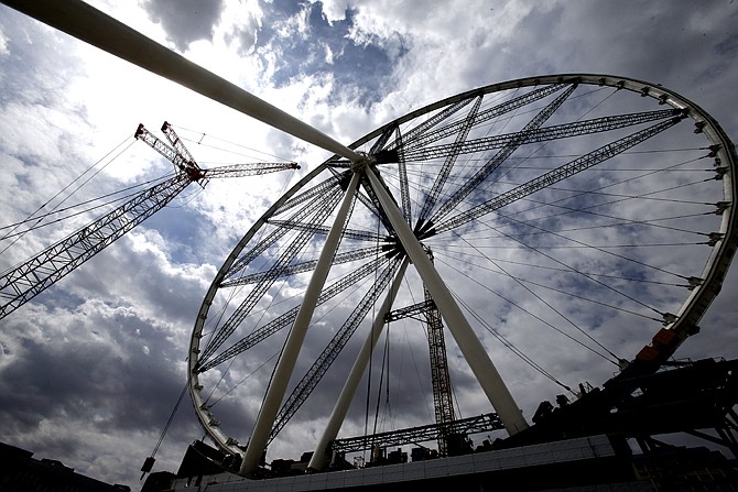 The final rim piece is added to the 55-story High Roller Ferris wheel under construction near the Las Vegas Strip. Caesars Entertainment Corp. is building the ride expected to open early next year.