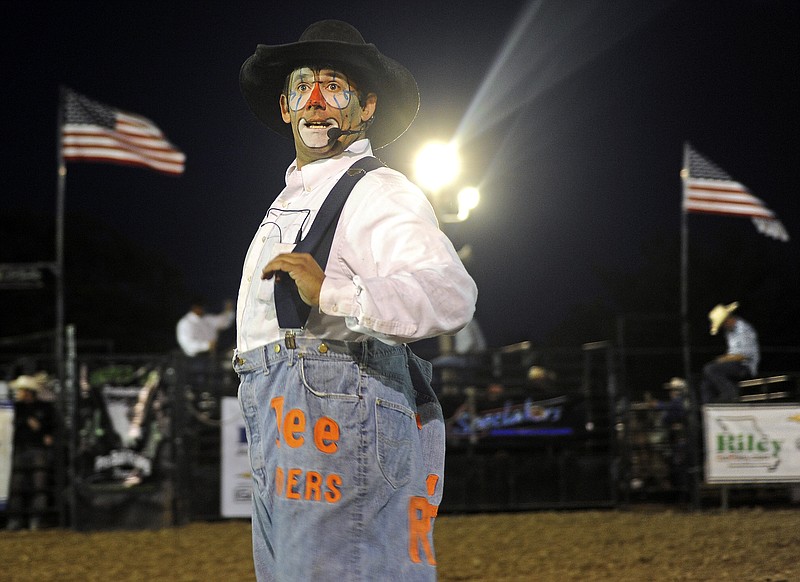 Rodeo clown Tuffy Gessling looks to the announcer's table while hamming it up for the crowd during Friday's Amped Up Productions pro bull riding event at the fairgrounds.