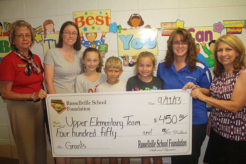 The Upper Elementary Team at Cole County R-1 School received a $450 grant from the Russellville School Foundation for materials to enhance their spring MAP Testing Motivational Skit. Pictured, from left, are Judy Price, foundation board member; Amber Shepherd, 3rd grade teacher; Cindy Wieberg, 4th grade teacher; and Kathy Koestner, foundation board member. Submitted photo