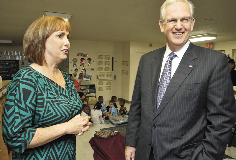 Jefferson City Day Care Center Director Donna Scheidt leads Gov. Jay Nixon on a tour of the day care prior to the announcement of a $200,000 grant awarded them under the Early Childhood Education Initiative. 