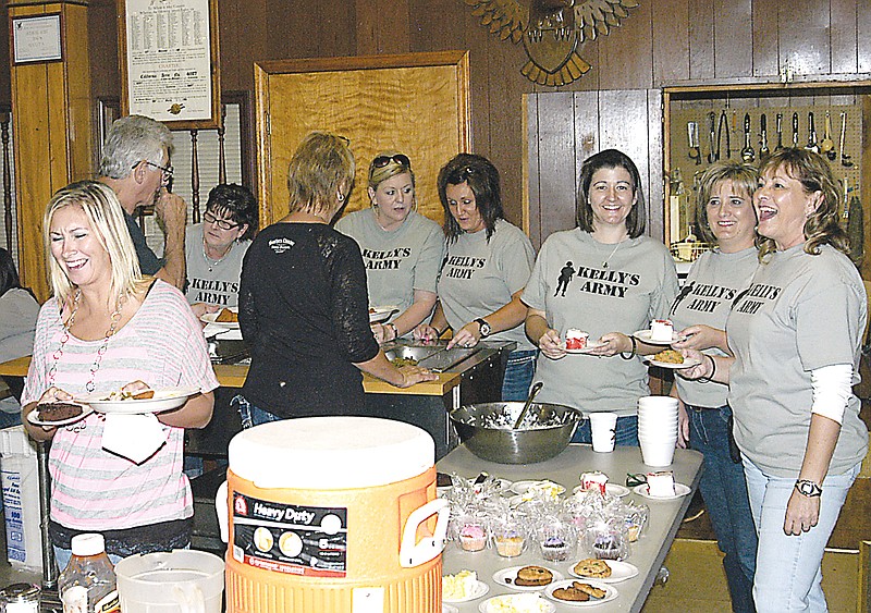 Serving the chicken strip dinner at the Messerli Benefit at the California Eagles Club on Saturday, Sept. 14, are, behind the tables from left, Kathy Allen, Karen Dameron, Kelley Owsley, Penny Harris, Cheri Messerli and Becky Bax .