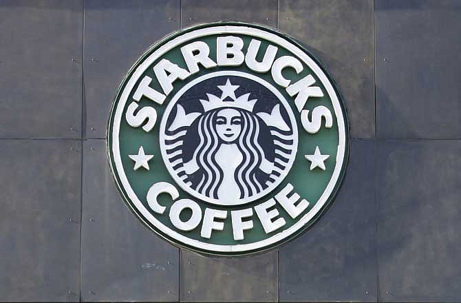 The Starbucks logo on its Seattle corporate headquarters is seen in this Monday, Jan. 26, 2009 file photo.