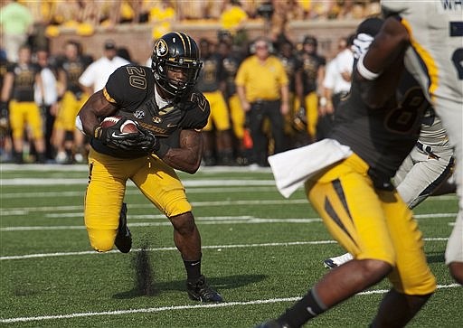 Missouri's Henry Josey looks for running room as he heads upfield during the third quarter against Toledo on Sept. 7 in Columbia.
