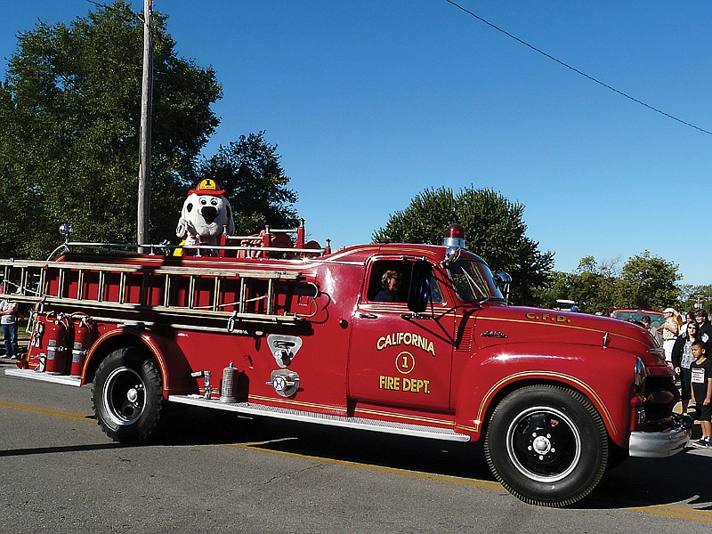 The 1954 Chevrolet Fire Truck traveling the parade route for the 23rd Annual Ozark Ham and Turkey Festival