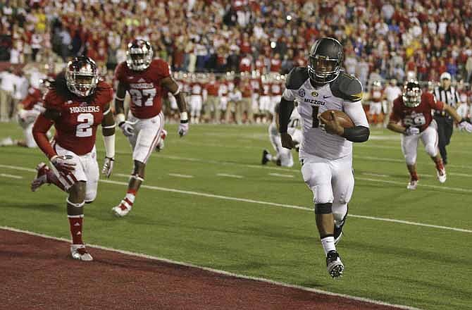 Missouri's James Franklin (1) runs for a 1-yard touchdown during the first half of an NCAA college football game against Indiana Saturday, Sept. 21, 2013, in Bloomington, Ind.