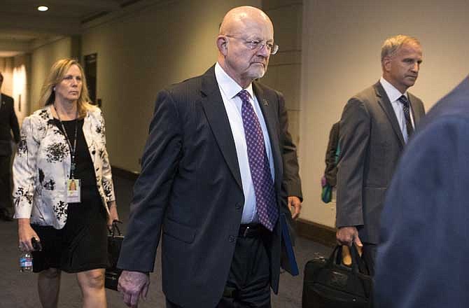 National Intelligence Director James R. Clapper arrives at the Capitol in Washington on Monday, Sept. 9, 2013.