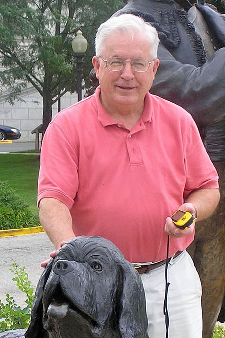 Bill Stine poses for a photograph at the Lewis and Clark monument. With a GPS device in his hand, Stine said this was the type of technology developed by the Air Force as far back as the late 1960s.      