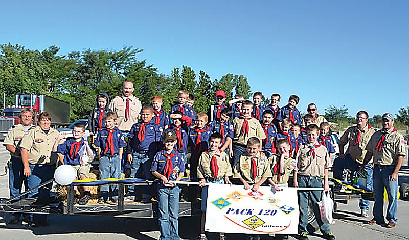 Cub Scout Pack 120 participated in the 23rd Annual Ozark Ham and Turkey Festival Parade.