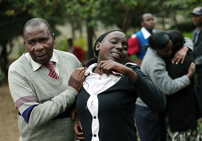 Relatives of Johnny Mutinda Musango, 48, weep after identifying his body Tuesday at the city morgue in Nairobi, Kenya. Musango was one of the victims of the Westgate Mall hostage siege. 