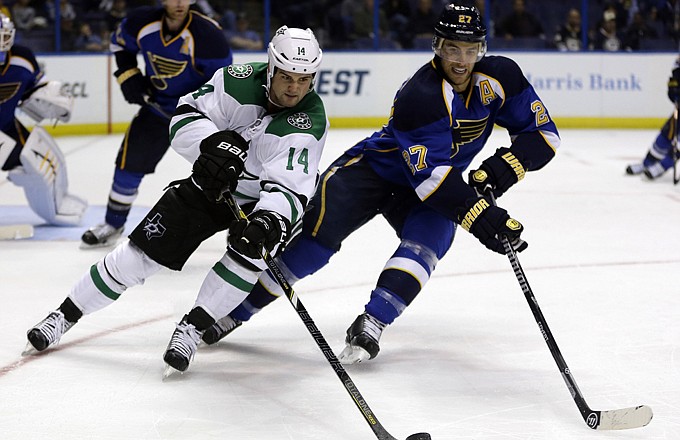 Alex Pietrangelo (right) of the Blues, shown here defending against Jamie Benn of the Stars in Saturday's preseason game in St. Louis, has a new seven-year contract.