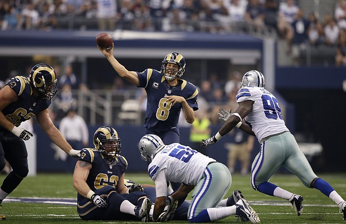 Rams quarterback Sam Bradford throws under pressure during last Sunday's game against the Cowboys in Arlington, Texas.