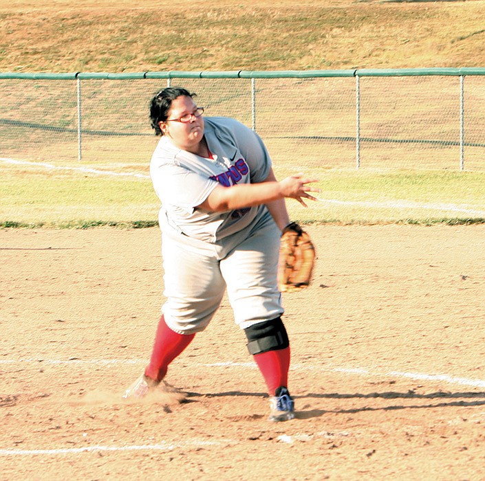 California's Jessica Hughes releases a pitch during the varsity softball game at the California Sports Complex. 
