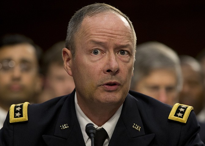 National Security Agency Director General Keith Alexander testifies Thursday on Capitol Hill in Washington before the Senate Intelligence Committee hearing on the Foreign Intelligence Surveillance Act (FISA), and National Security Agency call records. 