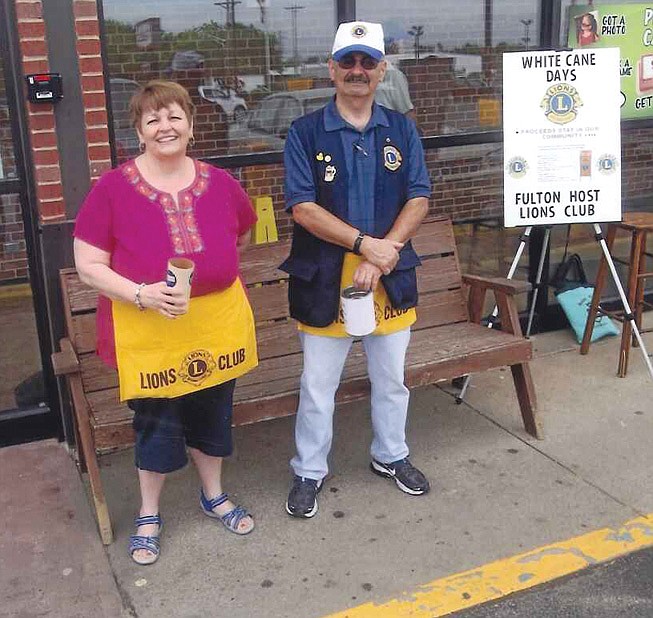 Susan Colvin and Emery Smola prepare to receive donations at Moser's during the Fulton Host Lions Club's spring White Cane Day drive. The Lions will return to Fulton grocers Oct. 4 to collect money to help people in the local community afford eye exams and glasses.