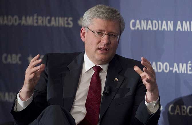  Canadian Prime Minister Stephen Harper takes part in a discussion with the Canadian American Business council in New York, Thursday Sept. 26, 2013. Harper said he "won't take no for an answer" if the Obama administration rejects the controversial Keystone XL pipeline to the U.S. Gulf Coast.