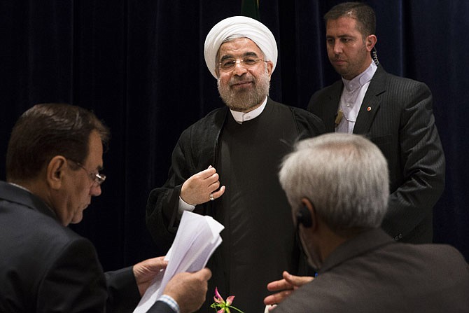 Iranian President Hassan Rouhani smiles at the end of a news conference at the Millennium Hotel in midtown Manhattan, Friday, in New York. 