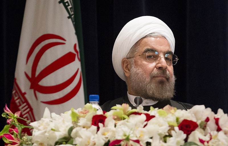 Iranian President Hassan Rouhani takes his chair Friday before a news conference at the Millennium Hotel in midtown Manhattan in New York.