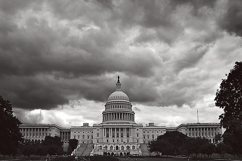 Storm clouds hover over the U.S. Capitol as the budget showdown nears.