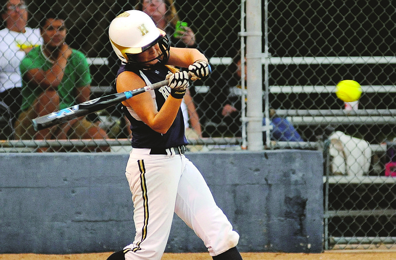 Helias third baseman Paige Bange hits a solo home run in the bottom of the first inning during the Lady Crusaders' game against Rock Bridge on Monday at Duensing Field.